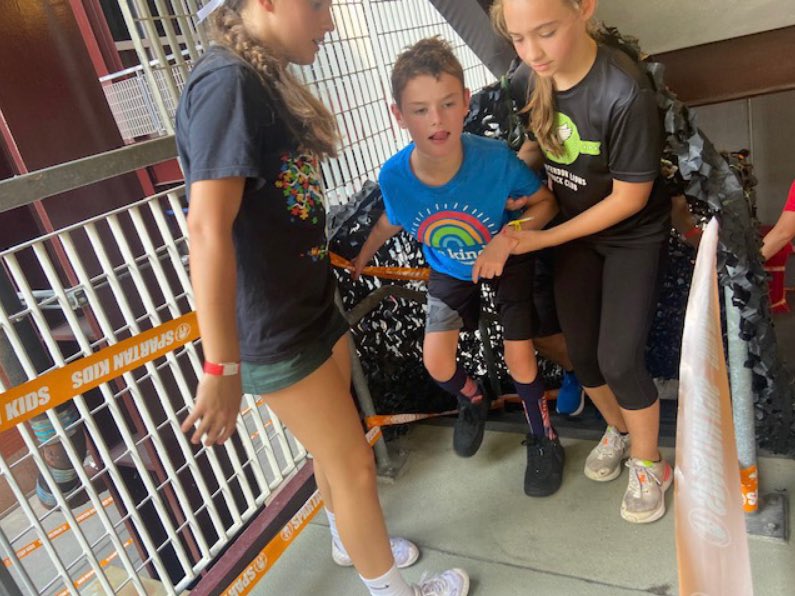 PedsOrthoCenter's tweet photo. Congratulations to 13 year-old patient Callum for completing his first Spartan Race this past weekend! Prior to his surgery in June of last year, Callum was unable to walk without assistance. Pictured here is Callum with his family, race volunteers, and Dr. Mark Solomon. https://t.co/bExBw7PhZ1