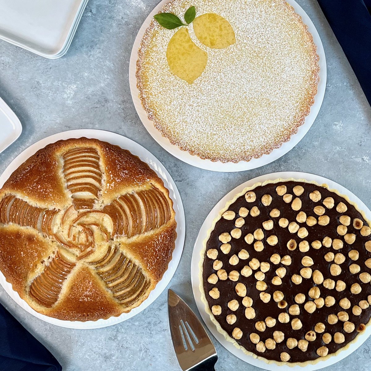 I took a break from cake today and instead made a trio of tarts.

Pear frangipane with cardamom; tangy lemon with basil garnish; and chocolate hazelnut with hints of orange &amp; brandy. 

Happy birthday(s), birthday peeps!
