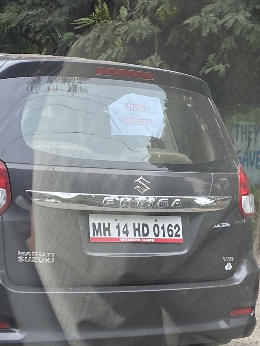 Dittu20's tweet photo. @PuneCityTraffic Is this allowed? Sticking Bharat Sarkar on rear wind shield. 
Place- Khadki Bazaar. Time- 8:45 AM https://t.co/2cVPjED9Bj