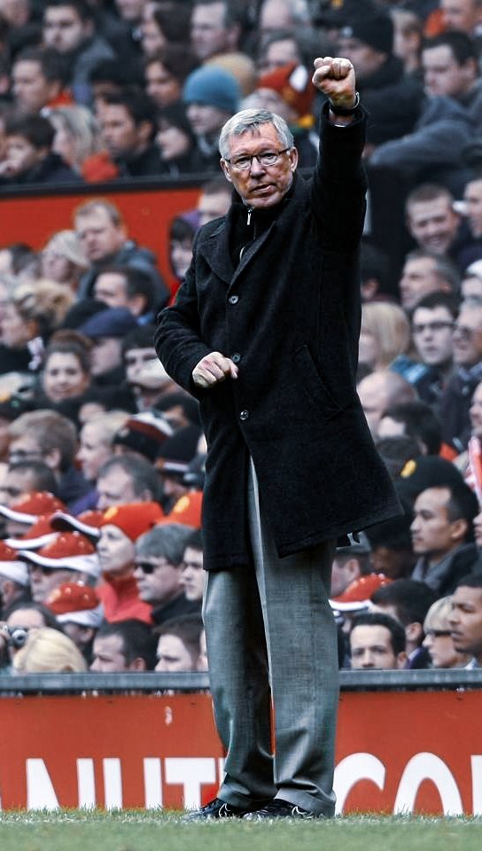 Sir Alex Ferguson acknowledges a racket of 'every single one of us, loves Alex Ferguson' being sang from the Stretford End, 2013.