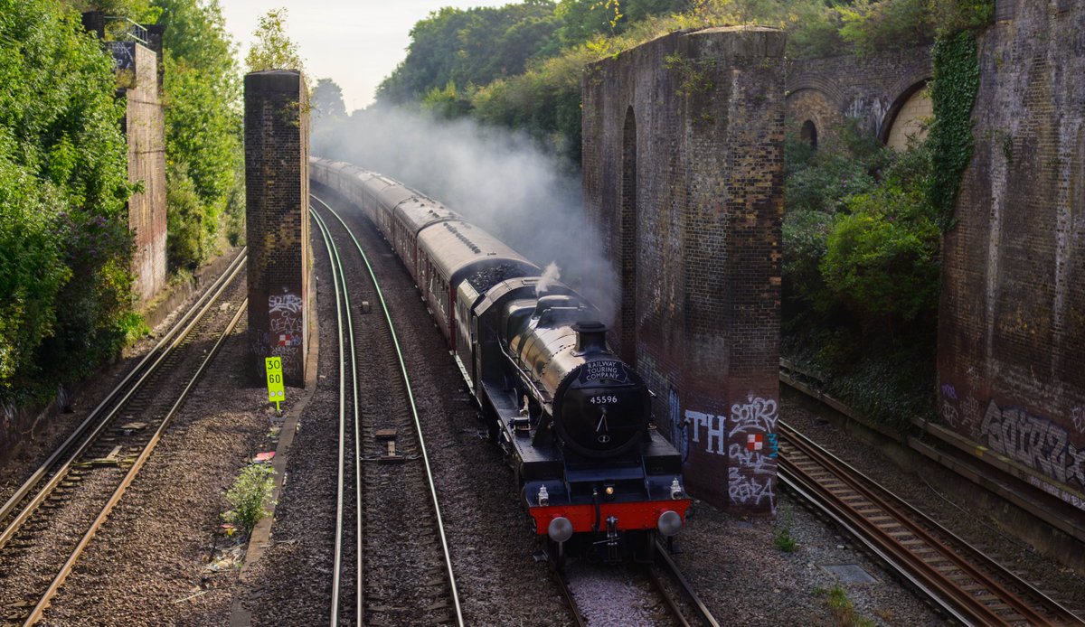 The last steam of summer. LMS No 5596 'Bahamas' heading through the Putney cutting on a misty morning, with a @railwaytouring special to Swanage.