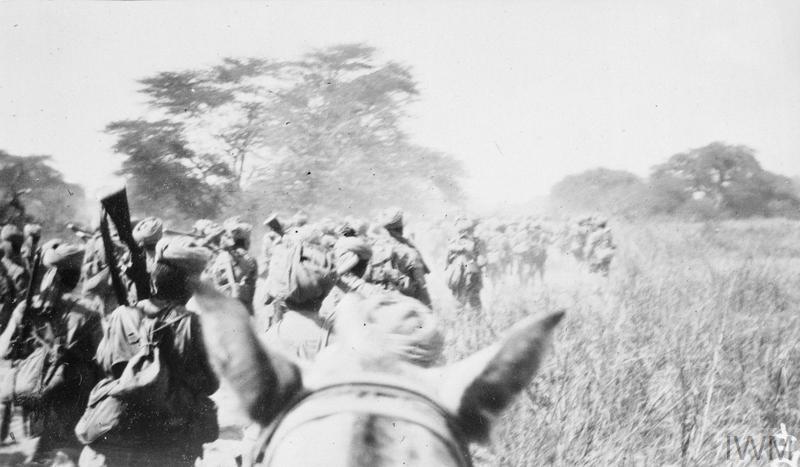 Indian troops in German East Africa, WW1. Pretty cool viewpoint, I suppose the officer on the horse had a personal camera.