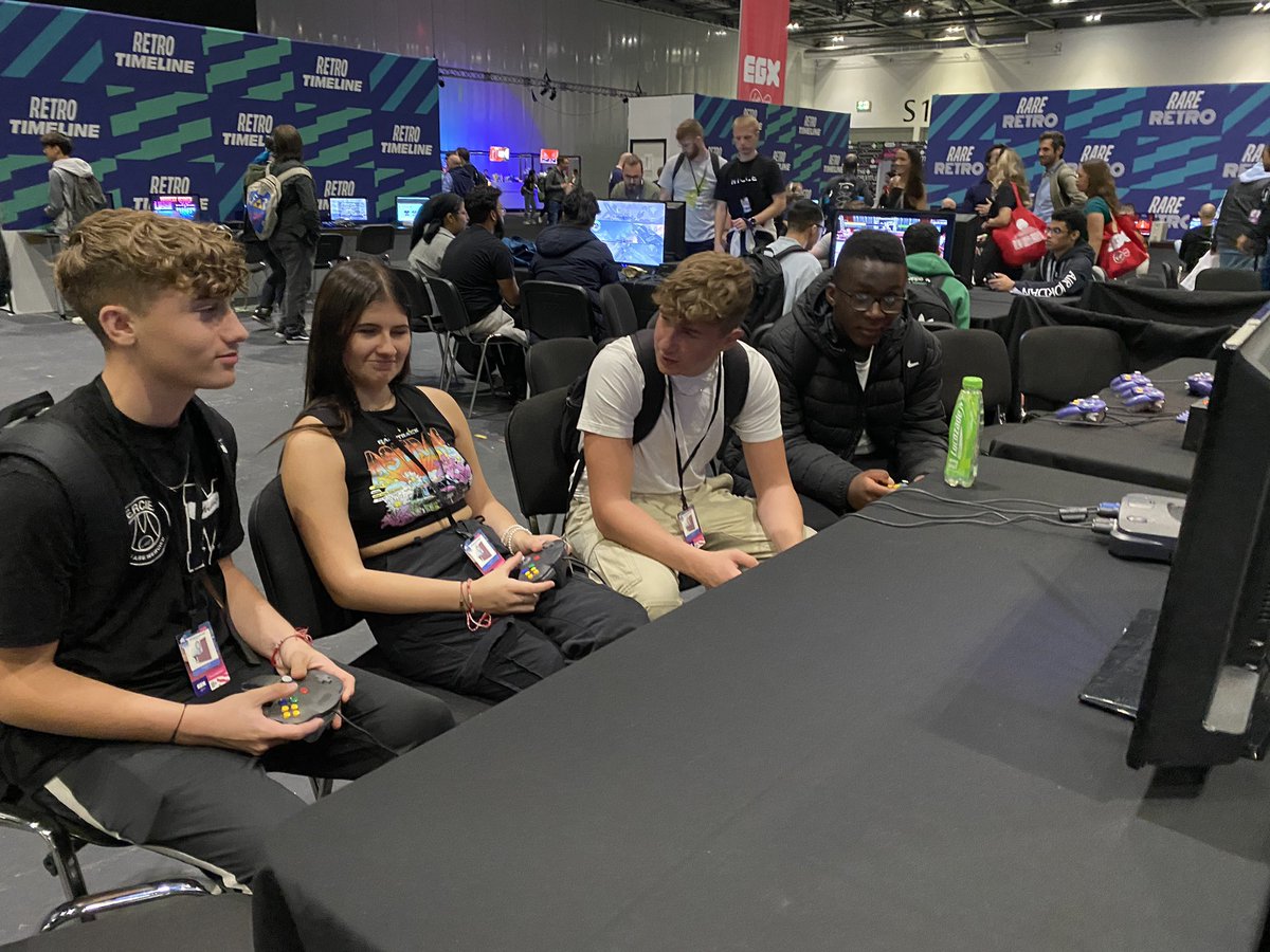 MrsTreliving's tweet photo. Students trying out the new games and having a go on some retro ones #EGX https://t.co/ROrqPmfajL