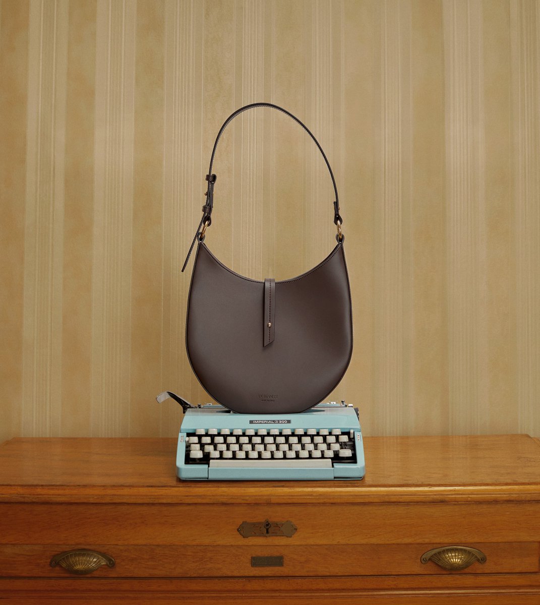 Sleek, chic and tapping into the trend for Nineties' minimalism, our Barbara hobo bag is crafted in Italy from beautifully-smooth chocolate brown leather. #LKBennett ow.ly/VZv350KPnn9