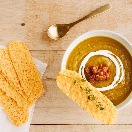 Happy Fall!🍁 Celebrate this cozy time of year with a warm bowl of butternut squash soup topped with bacon, crème fraiche, and Original Parmesan Crisps. #joyfullrecipes