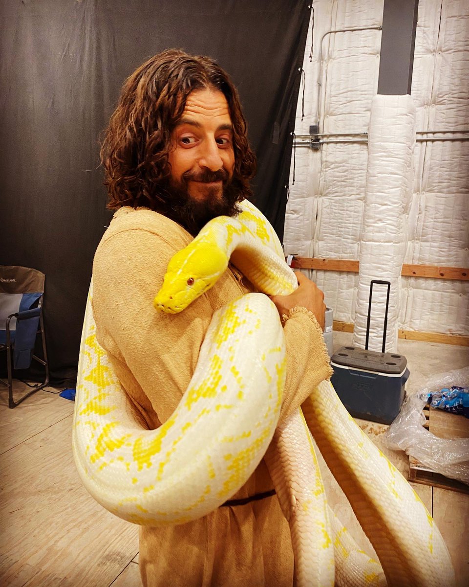 JonathanRoumie's tweet photo. Wrap week of Season 3 of @thechosentvseries be like…
😳🙃🤷🏻‍♂️ 
Me here with a gorgeous sweetheart of a slitherin’ friend that is a 16’ ft python named Penelope. 
Truly was a teddy-bear…a gigantic, coiled, reptilian teddy bear. 🧸🐍

#TheChosen #Season3 #Season3WillMeltYourFaceOff https://t.co/7Qh6FGg8hi