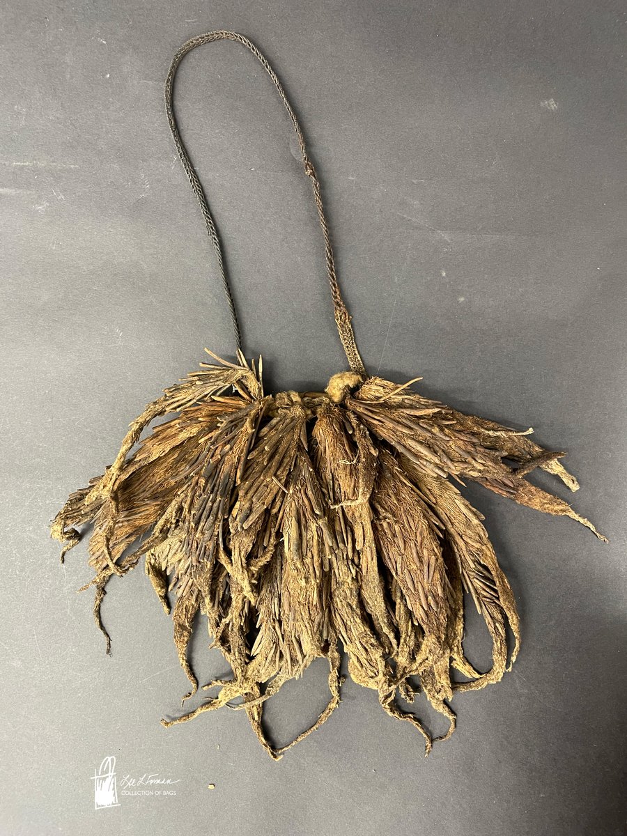 265/365: Among the more unique bags in the Lee L. Forman Collection of Bags is this brown hunting bag that is made from woven bush rope and decorated with insect cocoons and shells. The bag was field collected in 1998 in Highlands, West Papua New Guinea. 