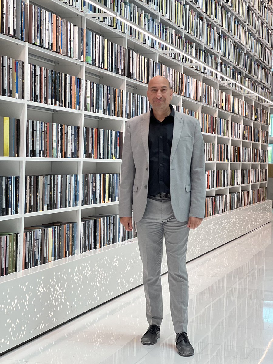 ayubkhan786's tweet image. Book-walls seems all the rage in new libraries recently; great for a photo backdrop #MBRLibrary PS: this is no wallpaper all physical books #library #design