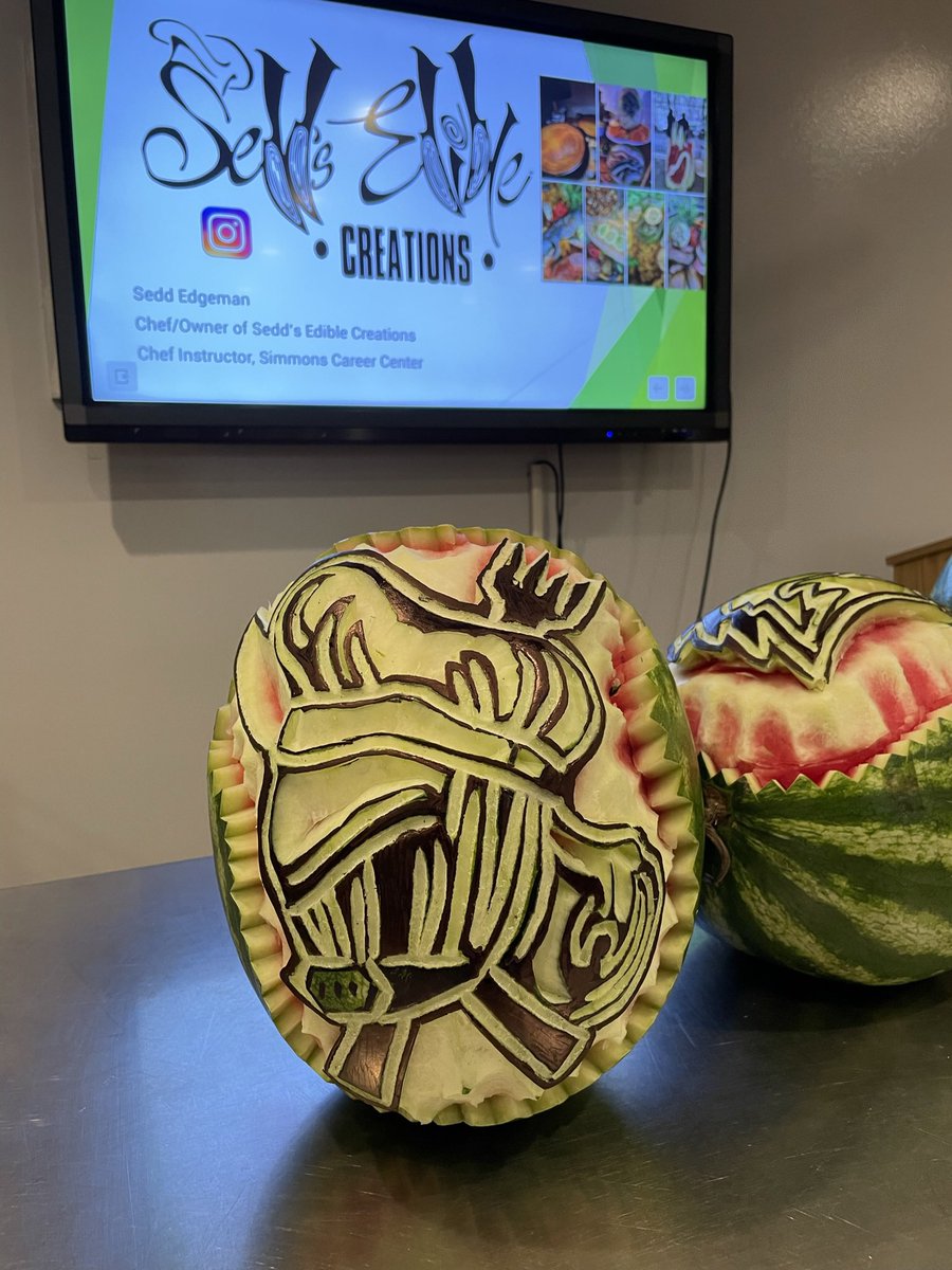 Had the pleasure of watching <a href="/SeddEdgeman/">Sedd Edgeman</a> showcase his carving skills by knocking out 3 logos from local high schools for our Culinary Skills Day today. #artist #fruitcarving #amazing