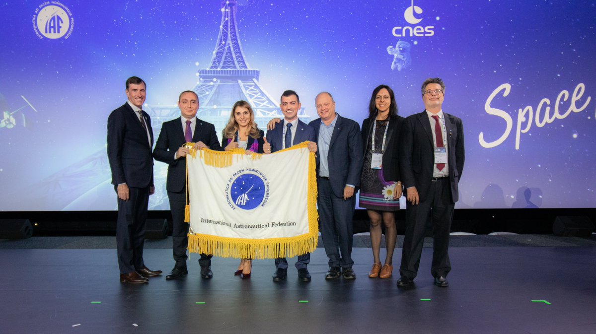 Iac2023's tweet photo. What an amazing Closing Ceremony of the @IACParis2022 - the @iafastro flag was handed to @Azercosmos1, the host of the #IAC2023! With this, starts the countdown until the space community convenes in Baku next year. We are so excited to welcome you in Baku on 2-6 October, 2023! https://t.co/aTBD1jPKyQ