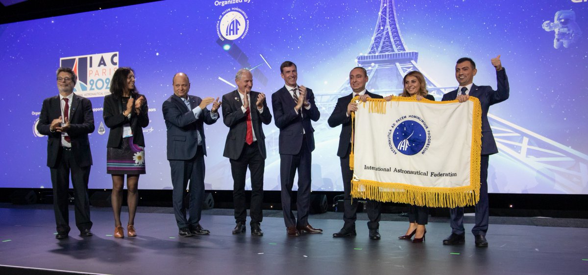 Iac2023's tweet photo. What an amazing Closing Ceremony of the @IACParis2022 - the @iafastro flag was handed to @Azercosmos1, the host of the #IAC2023! With this, starts the countdown until the space community convenes in Baku next year. We are so excited to welcome you in Baku on 2-6 October, 2023! https://t.co/aTBD1jPKyQ
