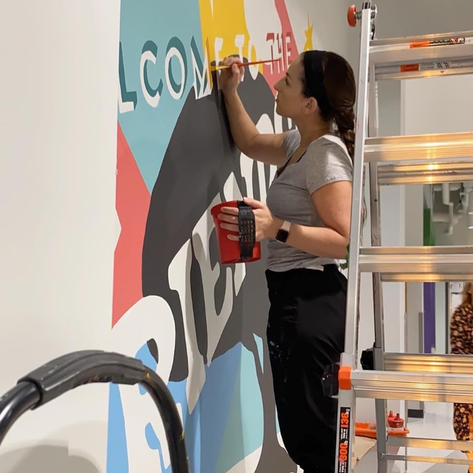 TaraYunker's tweet photo. She was an amazing teacher, and now she is an amazing artist! The mural is complete and our @AFESStars students got to watch the entire process. We are so lucky! https://t.co/ZpKa9yiZ7G