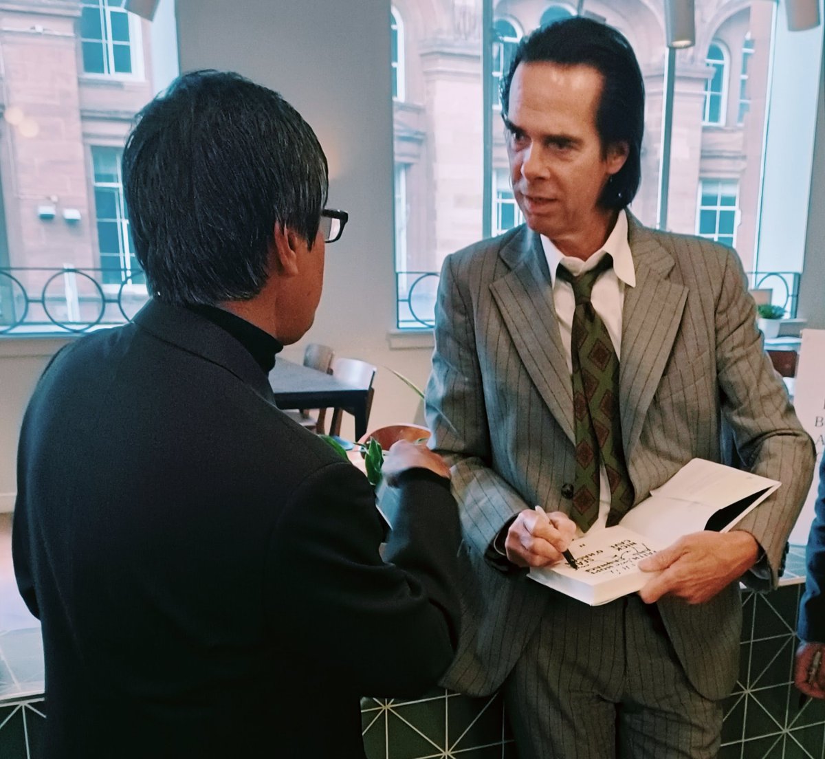 FuturePilotAKA's tweet image. Wow! Incredible micro-meet with one and only @nickcave on his 65th birthday at the book signing for Faith, Hope &amp;amp; Carnage
@canongatebooks with #SeanO'Hagan. We man hugged, chatted briefly about the book and then went into inevitable selfie mode.