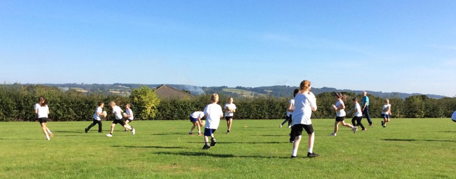 FirstHexham's tweet photo. Year 4 are really enjoying their PE lessons, they have been learning invasion  techniques ready to play tag rugby. Great attitudes, listening, teamwork and perseverance in what can only be described as one of the best sports fields with a  view in the Tyne valley and beyond. https://t.co/6zY32GrUSv