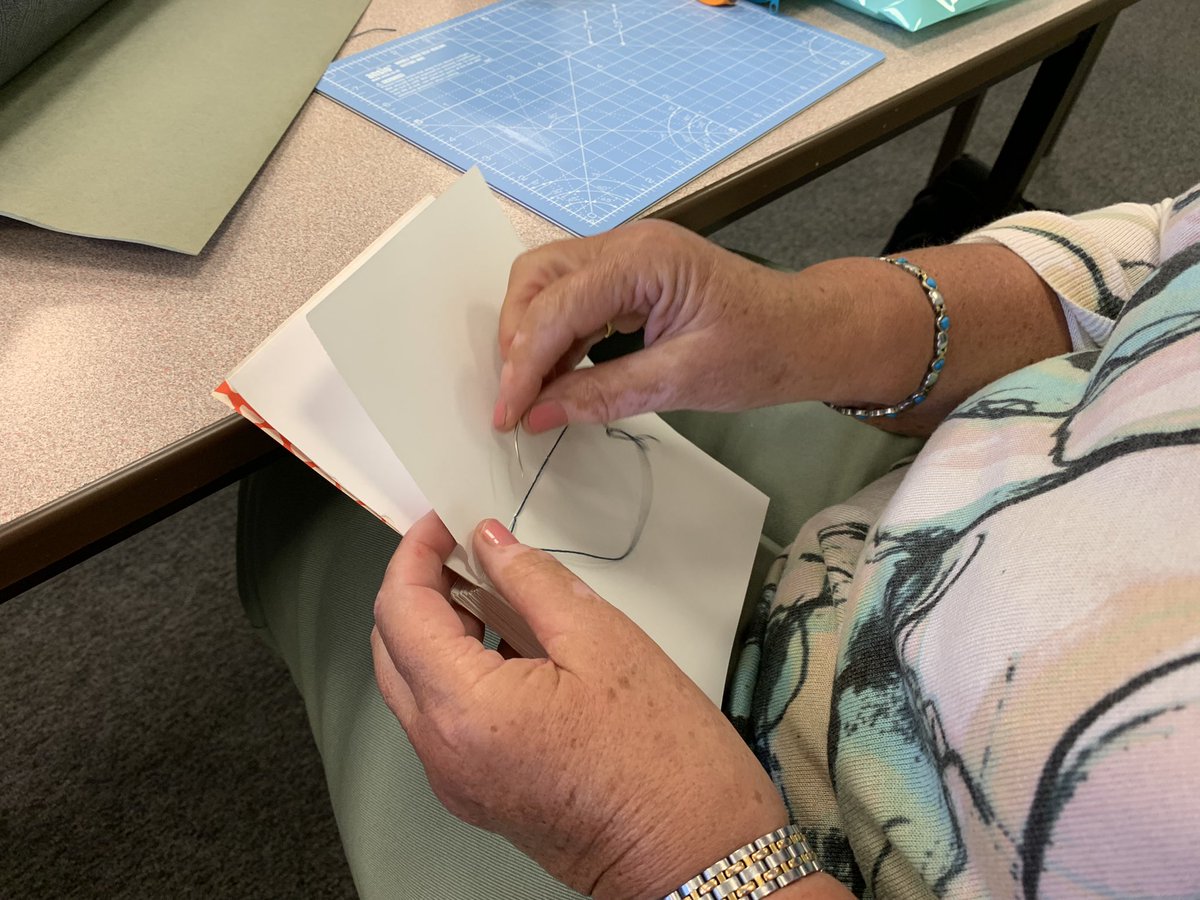 CreativeCallig's tweet photo. It was my Friday group’s turn to get stitching with @yvettejaa today as we continue our #bookbinding sessions. We’re taking inspiration this term from the Lindisfarne Gospels currently on show at the @LaingArtGallery in Newcastle. #calligraphy https://t.co/zKaT2nfJ8x