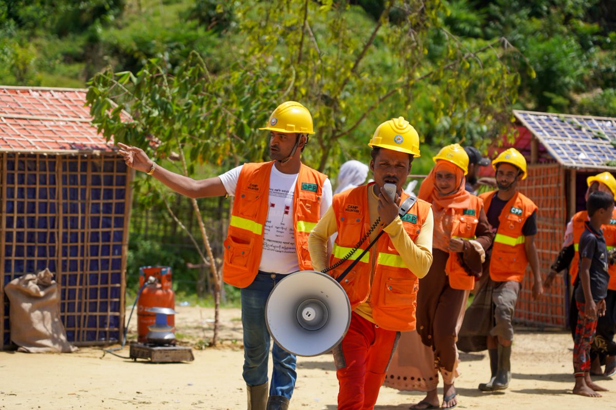 BDRCS1's tweet photo. A drill on Cyclone Early warning and Anticipatory Action in camp settlements jointly organized by @BDRCS1, #CPP, @ifrc and @IOMBangladesh in camp no 20 focusing on cyclone signal, Cyclone preparedness messaging, anticipatory actions, First Aid, casualty and needs assessment. https://t.co/U3FOIlBBFM