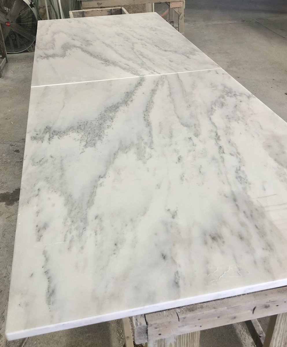 marbleandgranit's tweet photo. The look of two book-matched marble slabs never gets old👀….like these two slabs of @vermontquarries Honed Olympian White Marble for a 14’ long x 56” deep kitchen Island Top! #UseNaturalStone @MarbleInstitute @KBtribechat @thenkba https://t.co/4R2wXcokKz
