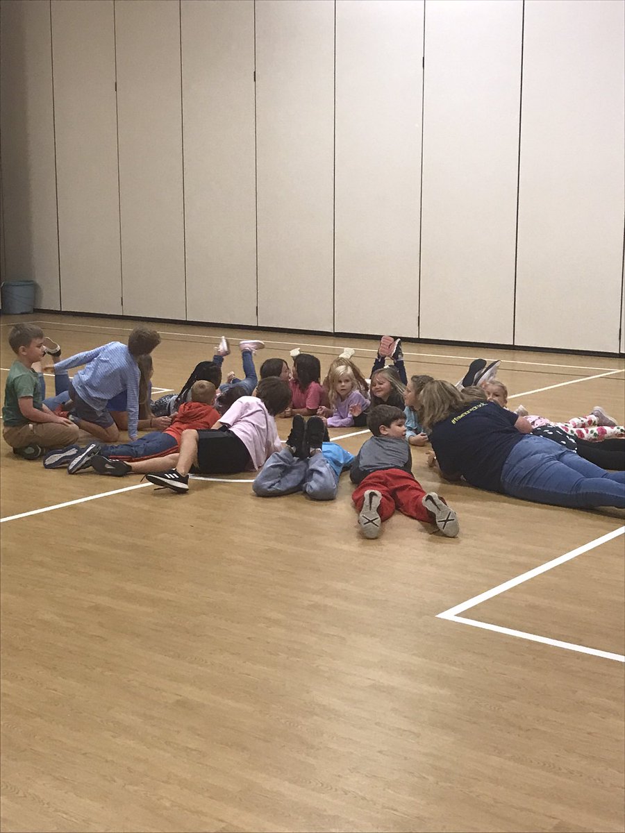 Mrs. Gibney and Miss Grove are teaching RAMS cooperation in the gym.