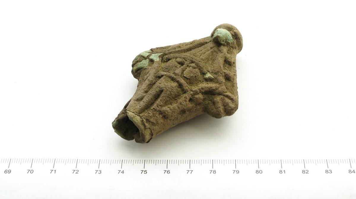 A #VikingAge find by metal-detectorists from #Nokia, Finland. It looks Scandinavian, but I don't know what it actually is. It seems to have been attached to something, but what? A magic staff? Both sides are identical with a face: a bearded man with a pointy hat. #FindsFriday
