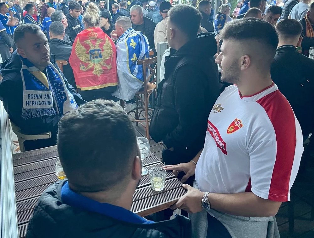 BiHFootball's tweet photo. Pictures like these are very rare in the Balkans. Bosnia-Herzegovina fans and Montenegro fans spend time together before kick-off. 

No hooliganism. No hatred. No problems. 

Just love. 

#BIHMNE #NATIONSLEAGUE https://t.co/o9sl2IScY2