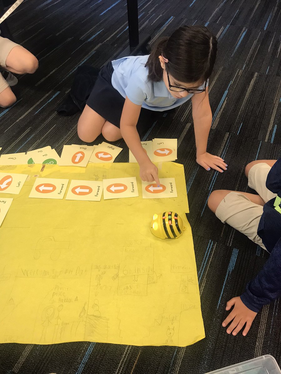 sciencegrl's tweet photo. Second grade using bee bot command cards to code around the “town “. #girlsrule#robots-r-fun https://t.co/B7uxhzcf8J