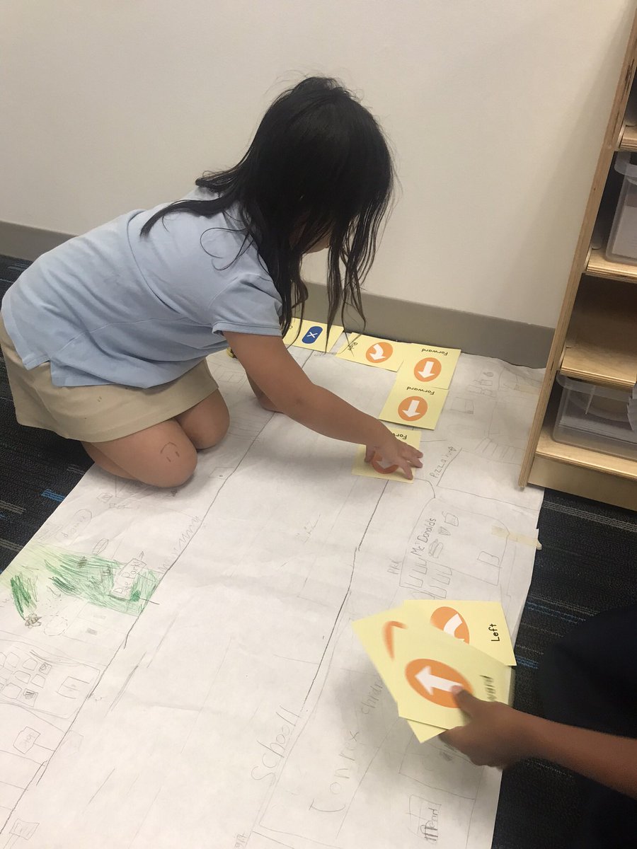 sciencegrl's tweet photo. Second grade using bee bot command cards to code around the “town “. #girlsrule#robots-r-fun https://t.co/B7uxhzcf8J