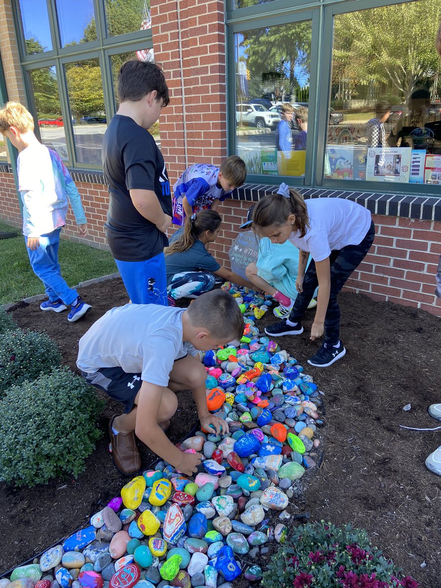 CBAWestChester's tweet photo. Fifth Grade added painted rocks to the CBA Rock Garden this afternoon. K-5th students each painted a rock for this beautiful garden started which was in 2017 #thinkkind #scribblestones #onlyatcba https://t.co/kWJAtiDoLm