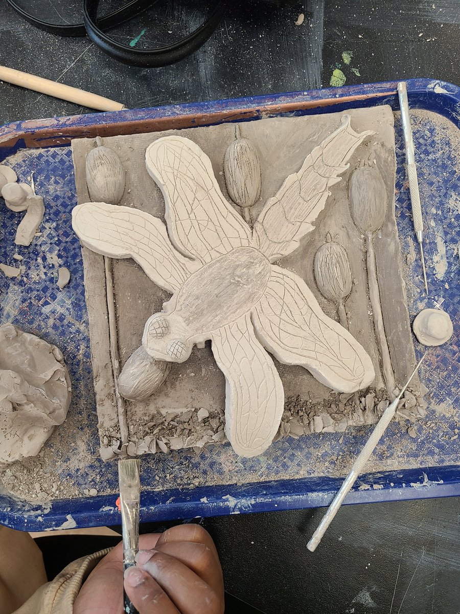 MrsRummenie's tweet photo. Sculpture students just finished their welcome back relief slabs. We were inspired by the still lives of Manny Farber and the self portrait symbolism of Frida. I can't wait to fire these and see them in color! Learning to express ourselves in another dimension! #arted #identity https://t.co/A2Cejk9e9N