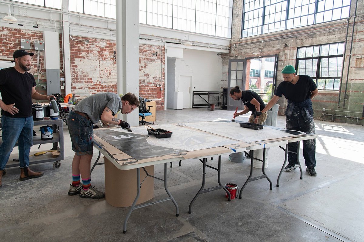 BuffaloAKG's tweet photo. #AKGPublicArt update: @YungYemi is working on a new #Polytab mural with the Public Art team, which is being installed at 1412 Main Street in #Buffalo. His work was on view as part of #InTheseTruths at #AKNorthland earlier in 2022. [📷 Amanda Smith] #BuffaloAKG #YungYemi https://t.co/b7FftsDhH6