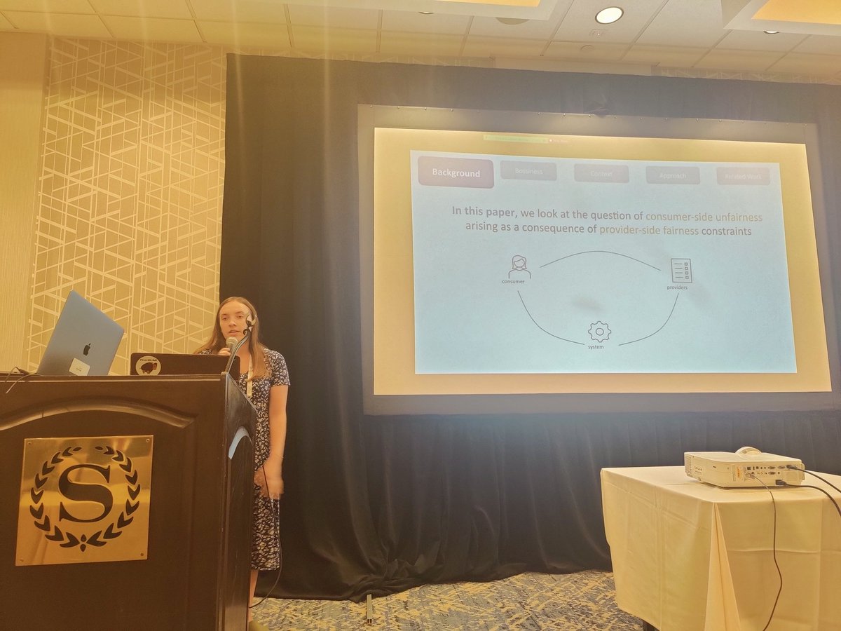 RajAmifa's tweet photo. Amanda Arid is presenting on personalization, bossiness and the cost of fairness @FAccTRec. Find the paper here: 
https://t.co/a8Z39ZnCUn
@ACMRecSys #RecSys22 https://t.co/Ie3XIUsmS4