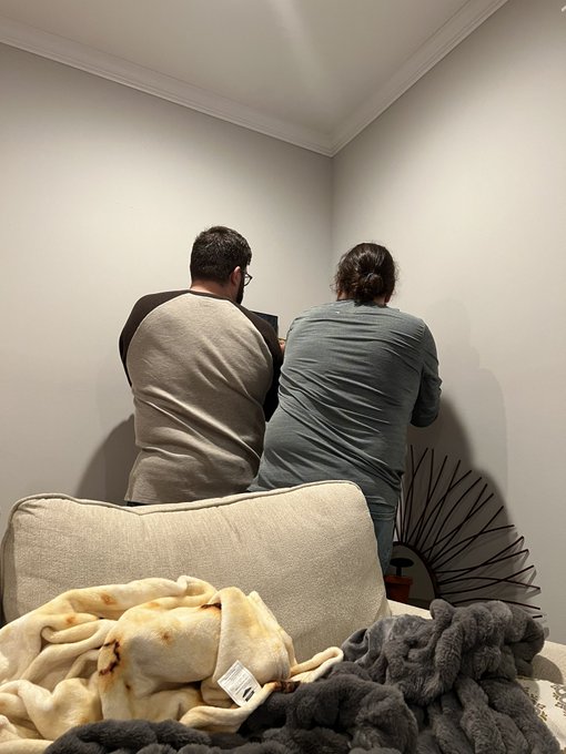 Perks of being #polyamorous is having two capable men hanging things up so you can just get tipsy off<a href="/tag/polyamorous"class="tags">#polyamorous</a>