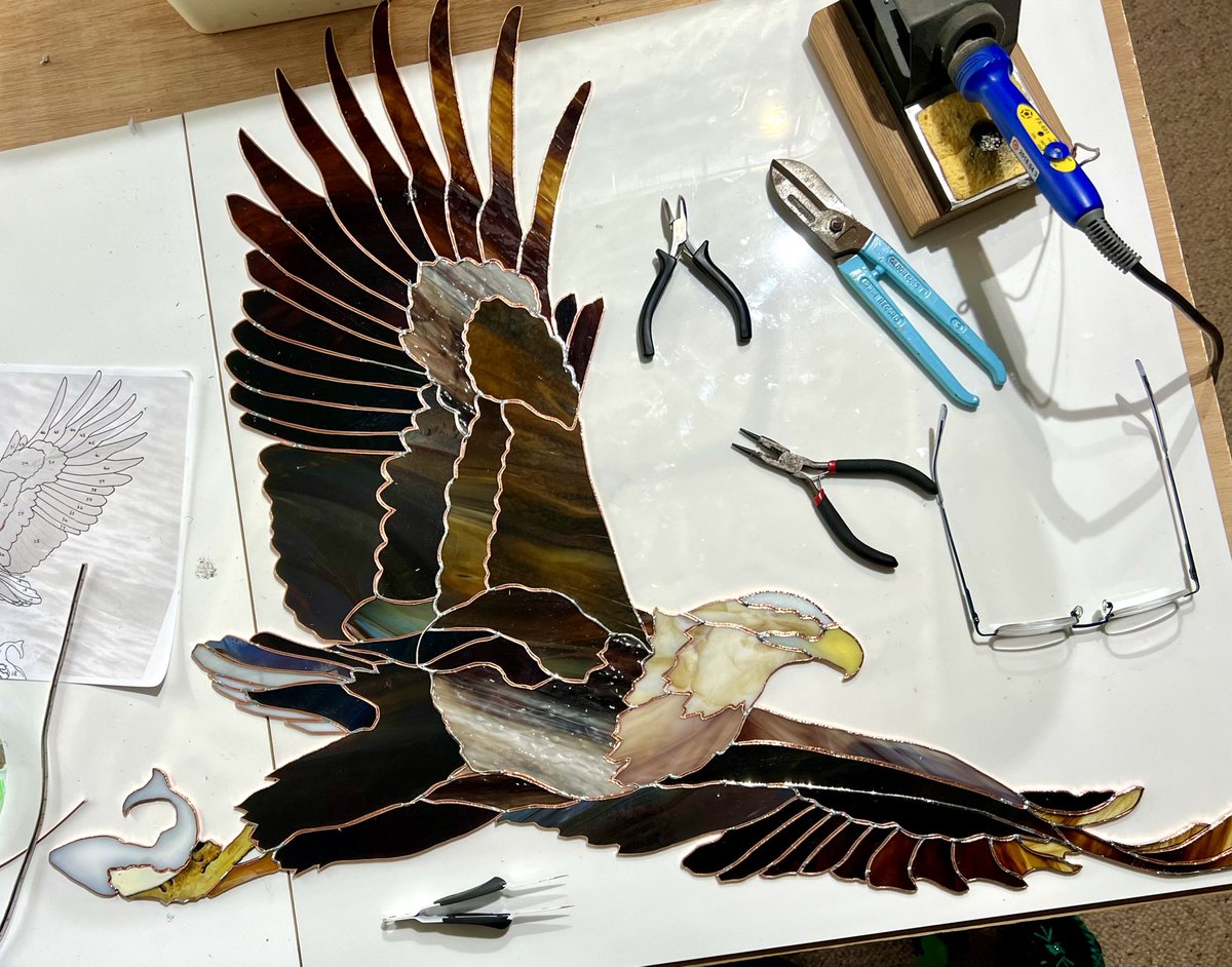 I need a bigger table. Because some birds are just *too much* to squash the bigness and the joy and the dance of them into a small idea… #WIP #glassart #birdart #eagle