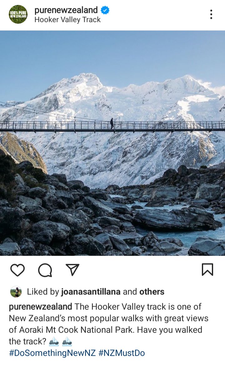 Pure new Zealand IG: Person walking a bridge against a mountainscape. Caption : the hooker valley track is one of new Zealand's most popular walks with great views of Aoraki Mt Cook national park. Have you walked the track? 