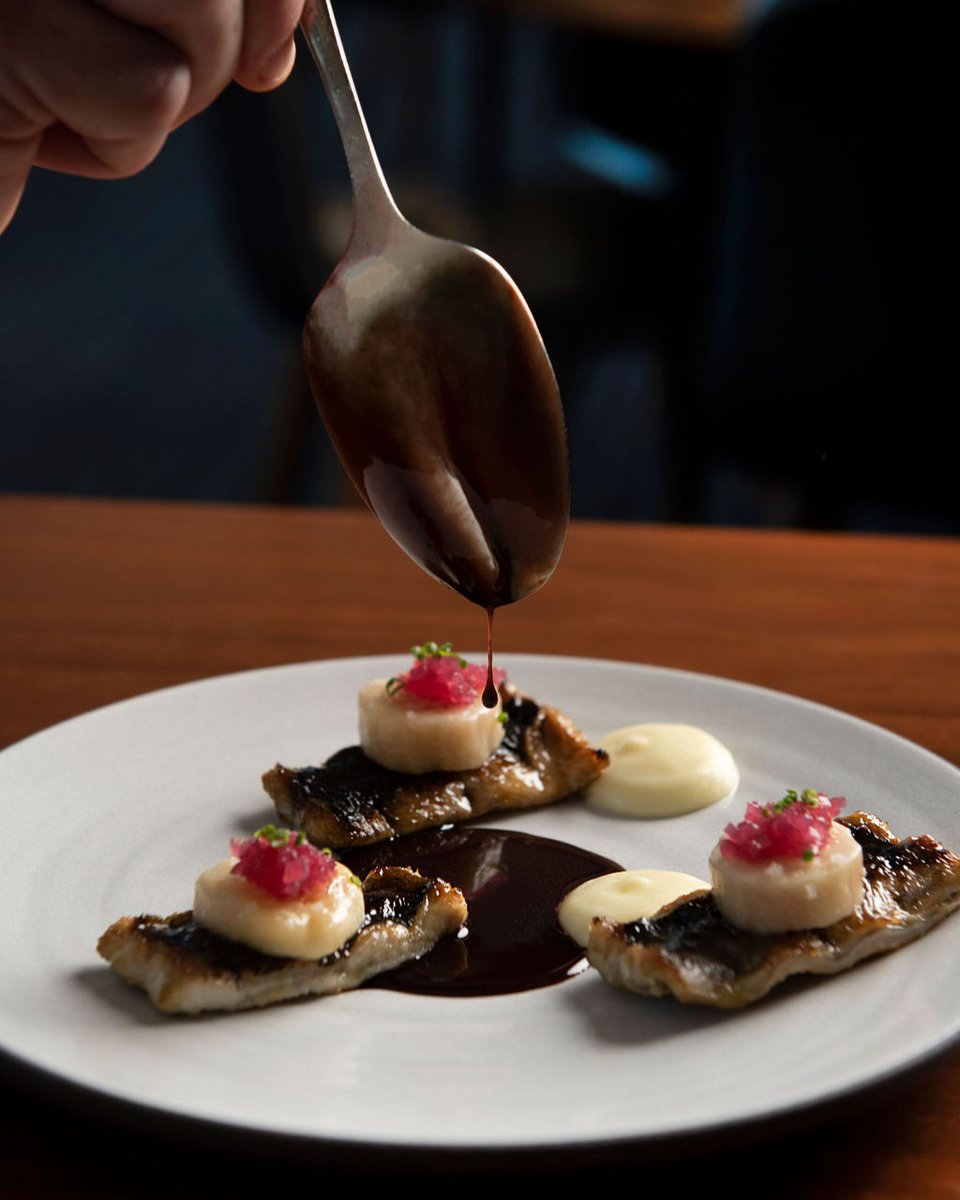 Montauk eel is barbecued over oak charcoal and served with poached bone marrow, pickled red onion, pomme puree, and red wine sauce meurette. 
.
📸: <a href="/lizclayman/">liz clayman photo</a> #manhatta #manhattanyc #fidi #fidinyc #nycdining #nytfood #eaterny #newrestaurant #actionshot #eel #unagi #moderncuisine