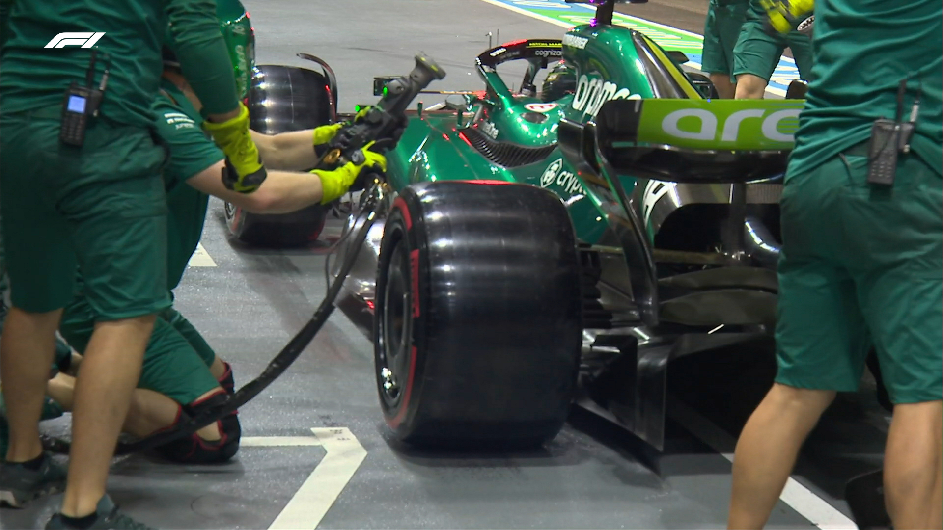 Slick tyres are seen fitted to the Aston Martin of Lance Stroll