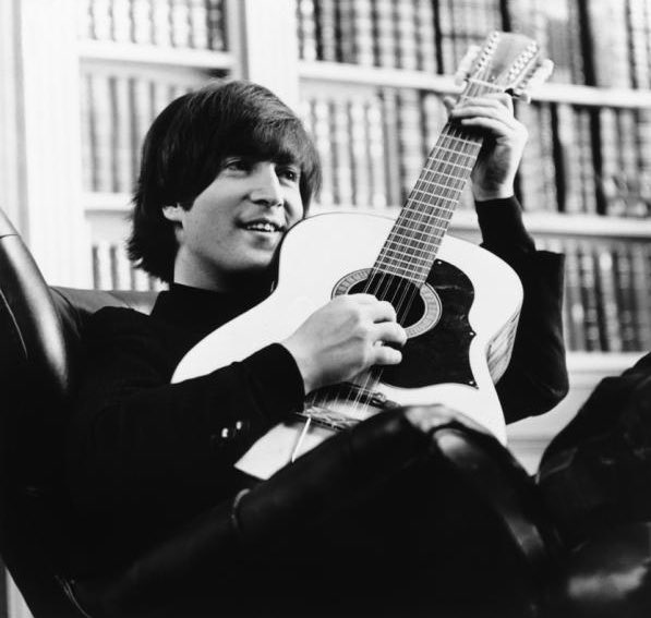 John Lennon photographed on the set of ‘Help!’, 1965. What a smile.