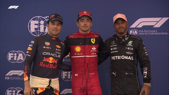 From left-to-right, Red Bull driver Sergio Perez, Ferrari's Charles Leclerc, and Lewis Hamilton of Mercedes can be seen linking arms after placing in the top three in qualifying in Singapore.