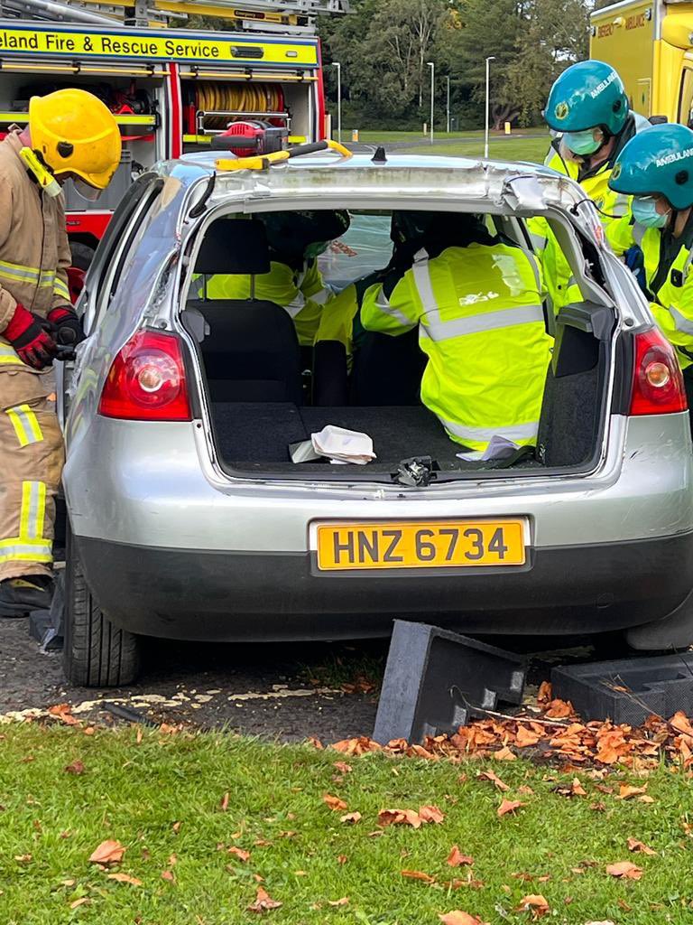 NIAS999's tweet photo. Our latest AAP course continue their training at @ulsteruni in Coleraine. This week they got to experience the benefits of interagency working with @NIFRSOFFICIAL at RTCs requiring extrication under the watchful eyes of tutors @mcgeownsean, @davidmarshall07 and @briansm https://t.co/bXxk1Y0SAr