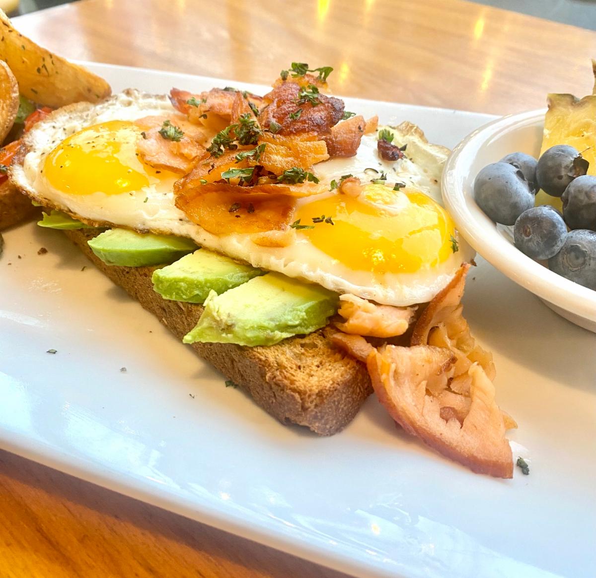 Pogacha's tweet photo. Brunch this weekend at Pogacha is this delicious Crispy Smoked Salmon Egg Stack for Brunch.  Crispy Smoked Salmon and creamy avocado are stacked atop Toasted Wheat Montana Seedover Small Batch Vegan Bread then finished with two Steibr eggs.  Add a Bottomless "Momosa"! https://t.co/n3sAIaJ3z8