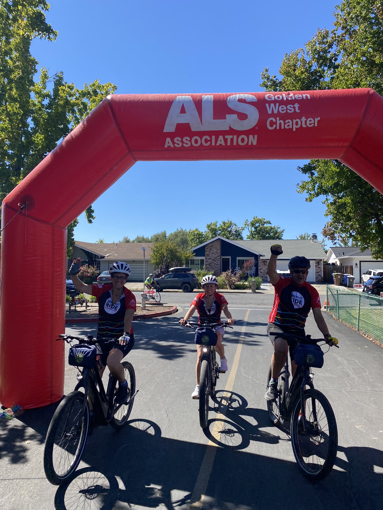 Risa, Luis, and Abby at the finish line of the Napa ride to defeat ALS