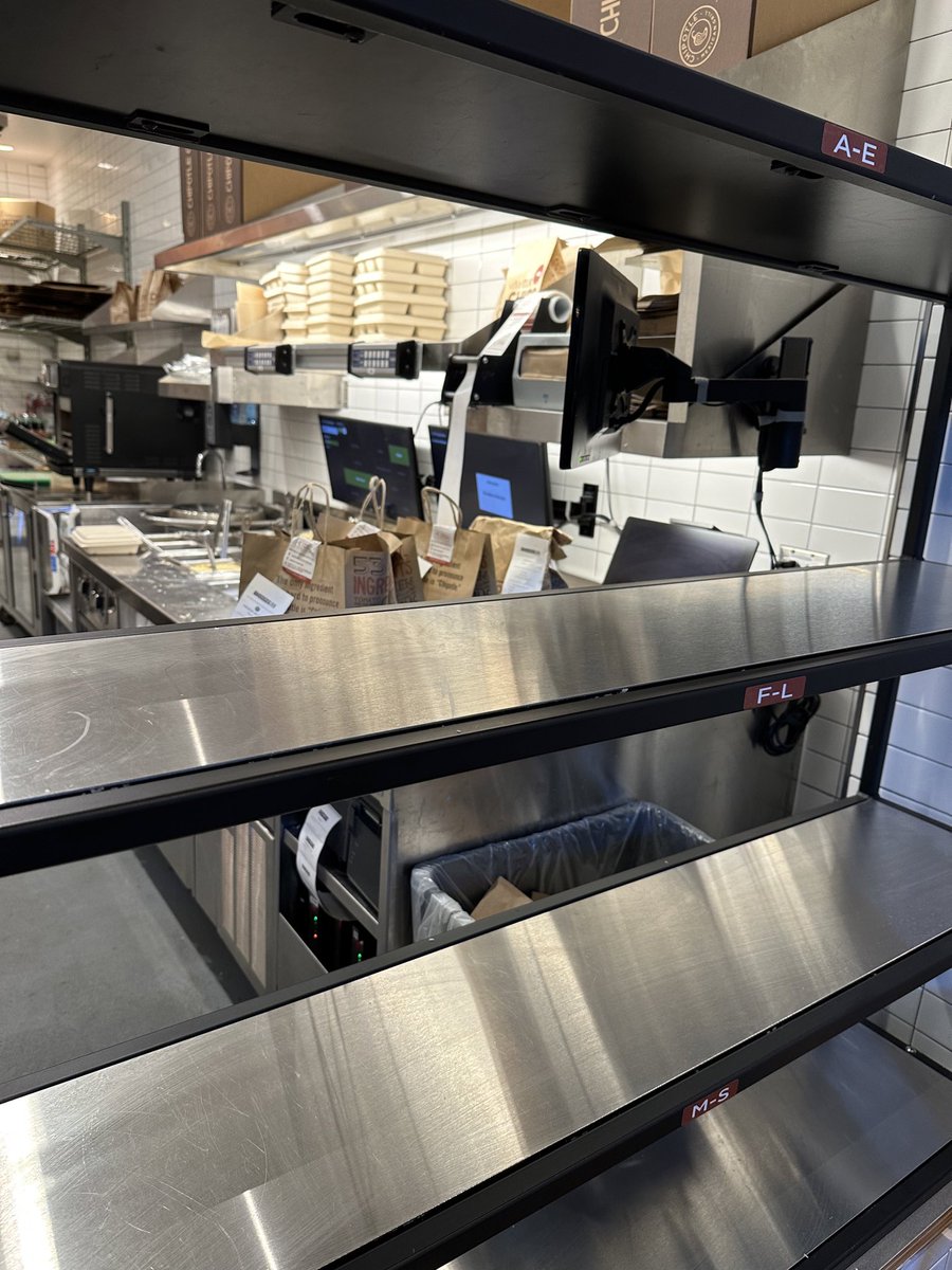 duneking1's tweet photo. @ChipotleTweets  what’s the point of these shelves at your locations if they don’t put the food out where I can grab it.  I could’ve just waited in line while I waited for them to hand me my food.  Not a good design. https://t.co/YIjvurz9I4