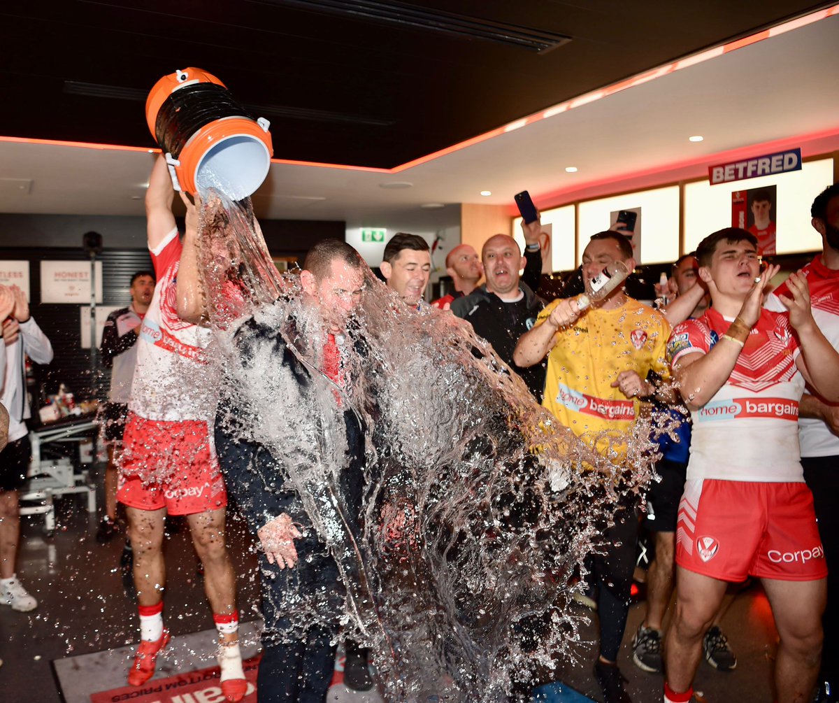 The obligatory Head Coach soaking to celebrate a #GrandFinal win 🚿 Signing off in some style, Woolfy! 😅 #COYS | @plattyphoto 📸