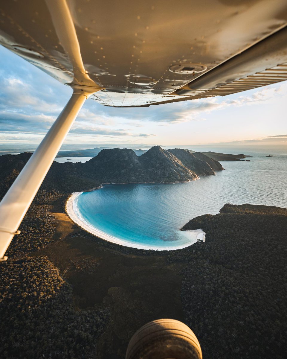 Wineglass Bay shines even brighter from the sky... 📍Wineglass Bay, Freycinet National Park, East Coast Tasmania  📷 IG/chad_gerber #DiscoverTasmania