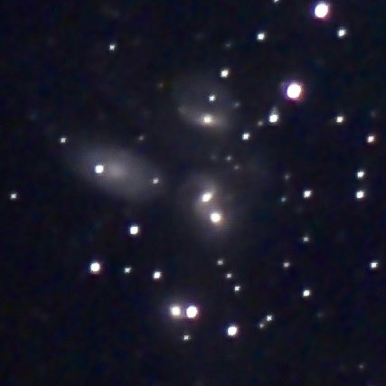 AstroMikeMerri's tweet photo. A little non-#LockDownAstronomy last night with the @Unistellar #eVscope to celebrate #JWST, reproducing one of those first images that it released of Stephan’s Quintet. To be fair, JWST isn’t sited in an urban back yard surrounded by trees, and collects 3000 times more light. https://t.co/qhie0me9fT