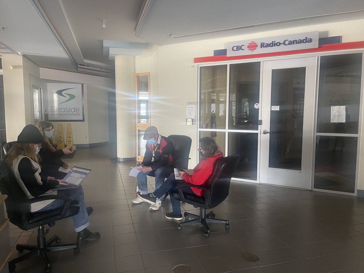 Triumphant colleagues at CBC Cape Breton persevering with no power. I just stumbled into this makeshift editorial meeting in the hallway. Gettin’ it done!