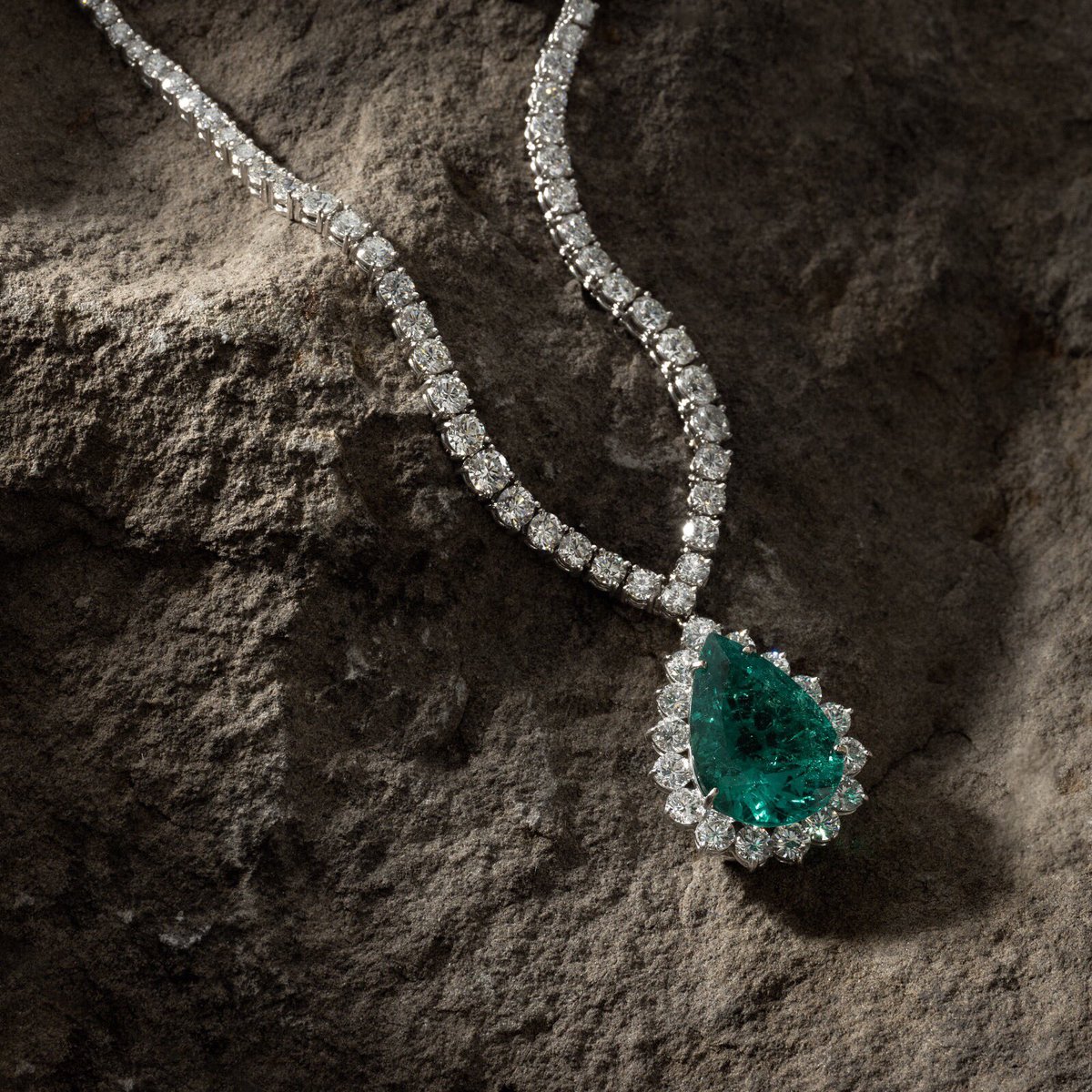 An elegant chain of platinum-set diamonds cascades down the mineral folds of nature, punctuated by a hypnotic teardrop emerald of unusual deep color. #EastContinentalGems

Emerald: 18.72 Carats
Diamonds: App. 25 carats
Set in Platinum