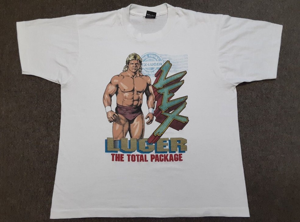 WCWTFPodcast's tweet photo. #WCWWorstMerch @GenuineLexLuger @WWE 

If there was ever a t-shirt that just SCREAMED late 80s/early 90s design, it's this bad boy right here. https://t.co/qK07dcQnks