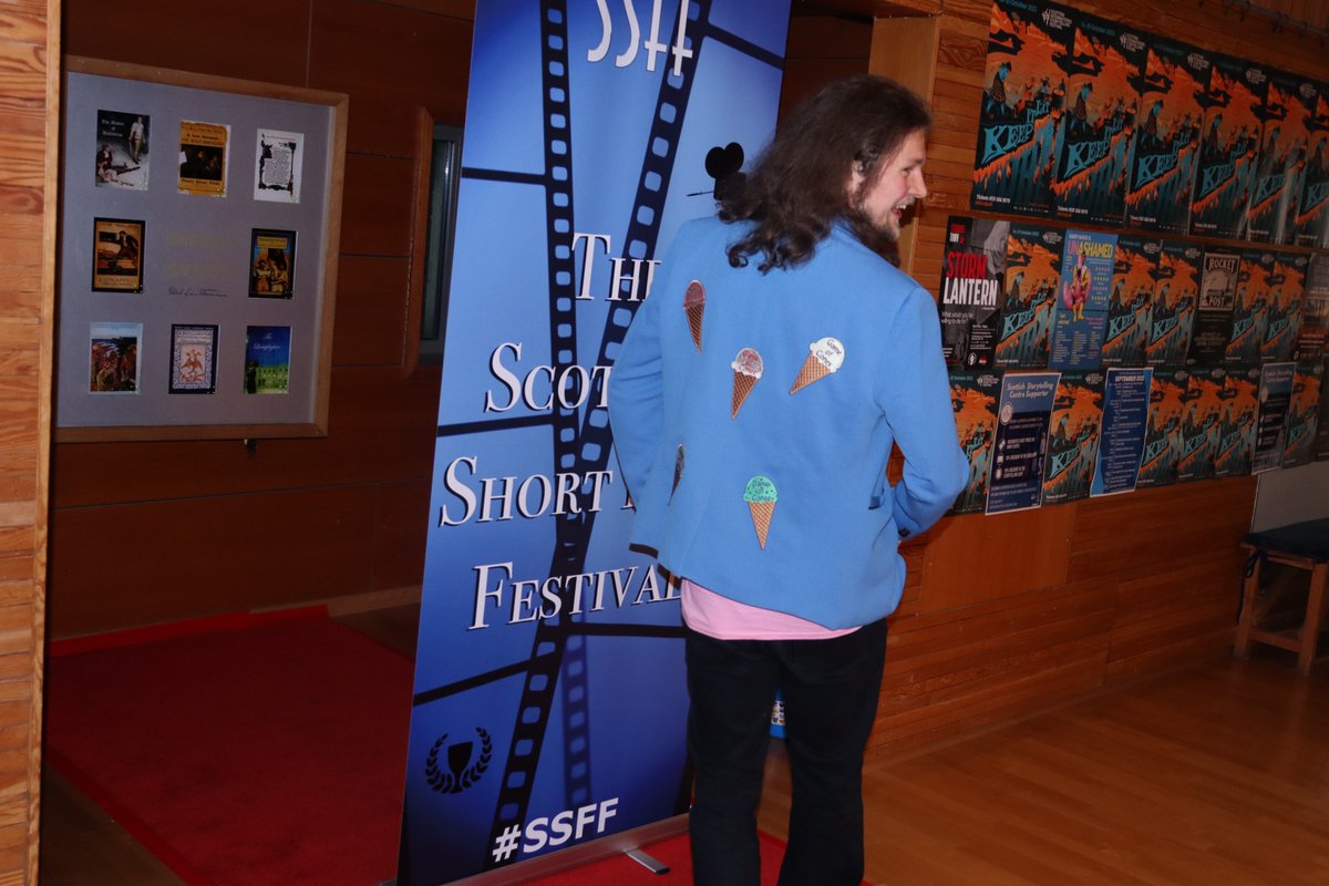 Scottishshorts's tweet photo. Paul Stirrat of 'Game Of Cones', by Graeme Watt and Lee Crompton, rocking the red carpet in his custom-made jacket!
@hello_acs @thaywoodphoto @Private_House @Wexpresif @raptorfilmz #SSFF #SSFF2022 #film #filmfestival #Scotland #indiefilm #indiefilmmaking #Scottish #shortfilm https://t.co/v2q4ODGyy4