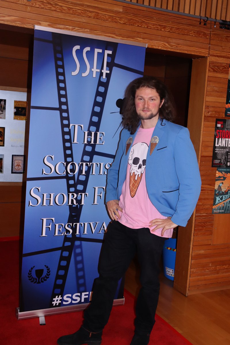 Scottishshorts's tweet photo. Paul Stirrat of 'Game Of Cones', by Graeme Watt and Lee Crompton, rocking the red carpet in his custom-made jacket!
@hello_acs @thaywoodphoto @Private_House @Wexpresif @raptorfilmz #SSFF #SSFF2022 #film #filmfestival #Scotland #indiefilm #indiefilmmaking #Scottish #shortfilm https://t.co/v2q4ODGyy4