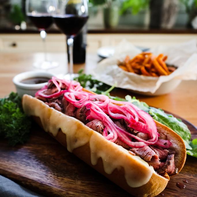 Fun fact: #FrenchDip, much like French fries, isn't actually from France. This cheesy, meaty sandwich is a yet another product of LA! Pair this iconic recipe with California's heritage grape - #Zinfandel. By: @girl_defloured Learn more: discovercaliforniawines.com/blog/famous-fo… @VisitCA